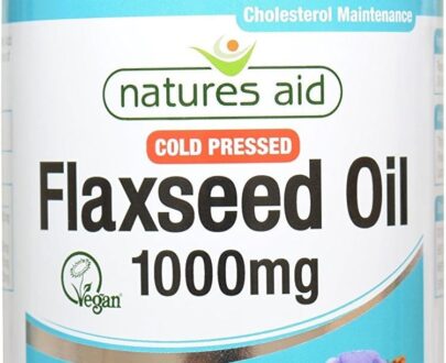 Bottle of Natures Aid Cold Pressed Flaxseed Oil capsules on a bed of flaxseeds.